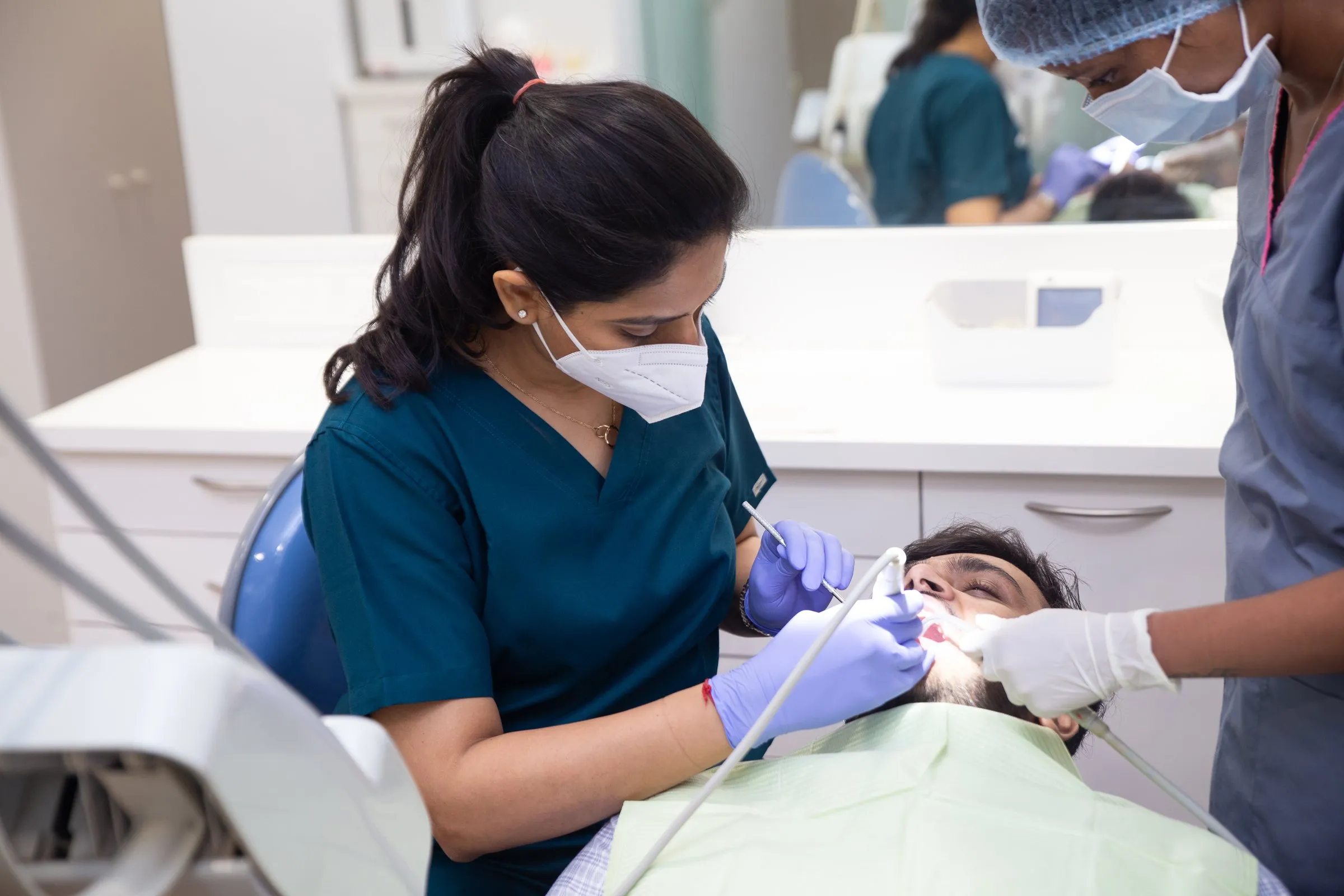 Treatment in progress with Dr. Upasana and an assistant